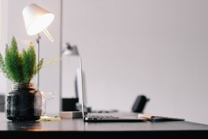 desktop with a laptop above on it